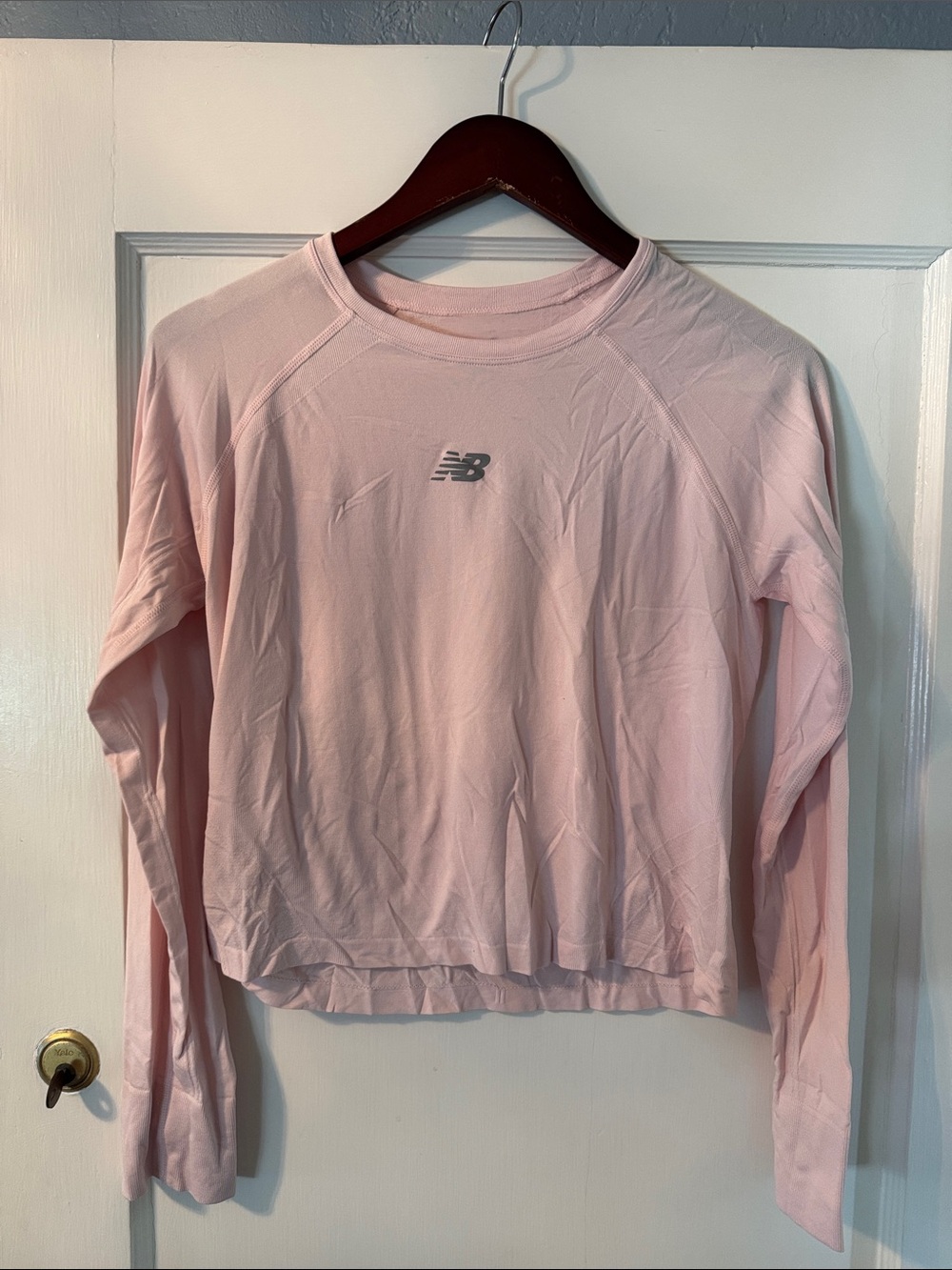 New Balance Women’s Light Pink Long-Sleeve Cropped Performance Top